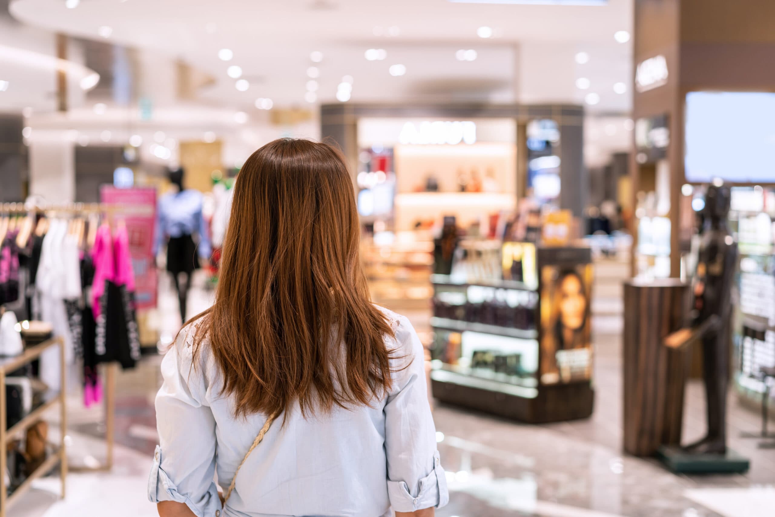 Shopper browsing a retail store with music playing overhead